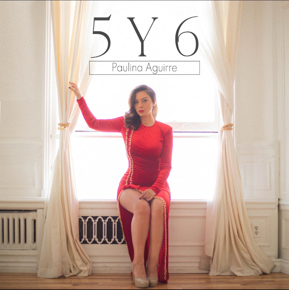 Paulina Aguirre red dress sitting